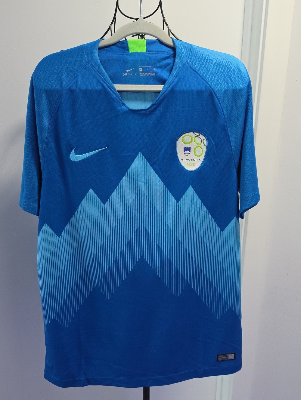 Nike Blue Slovenia Football Jersey with Light Blue Chevron Design